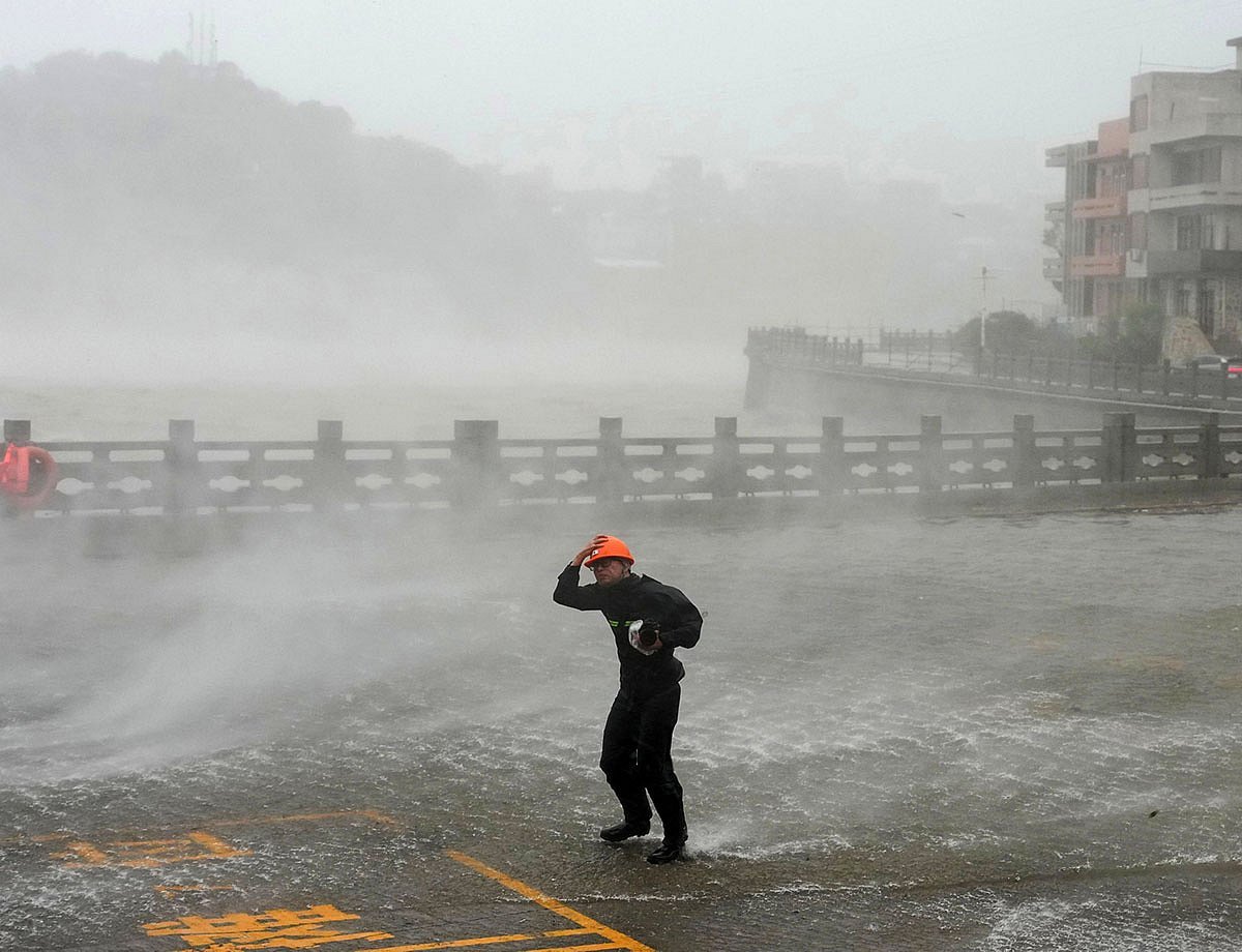 Typhoon Dolphin weakens but disrupts travel in east China